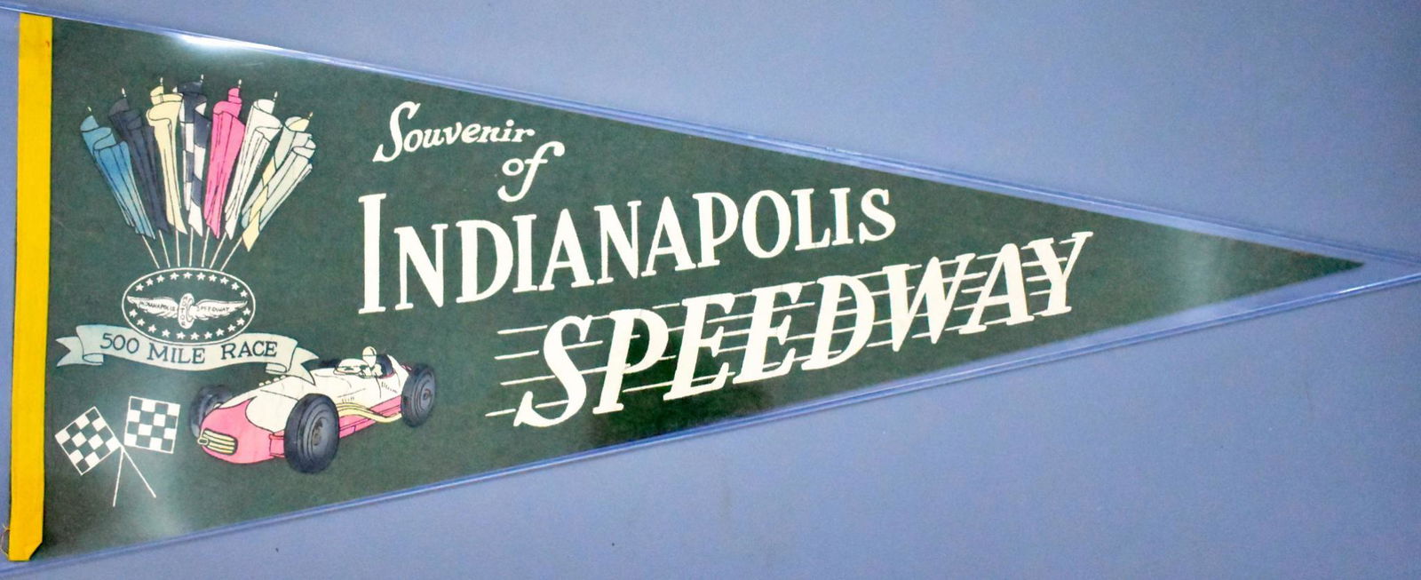 Vintage Indy 500 Indianapolis Motor Speedway souvenir: Vintage Indy 500 Indianapolis Motor Speedway souvenir felt pennant, likely from the 1950's and in very good condition with some cracking of the paint on the car, otherwise displays very nicely, measur