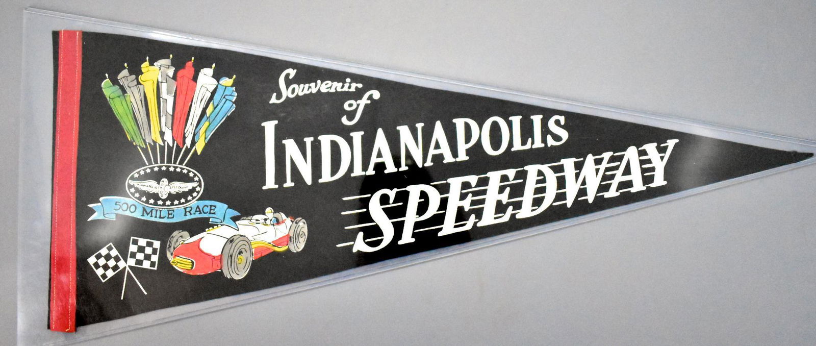 Vintage Indy 500 Indianapolis Motor Speedway souvenir: Vintage Indy 500 Indianapolis Motor Speedway souvenir felt pennant, very good to excellent condition but has a small hole at the end and tiny holes along the left border from pins or tacks, measures 2
