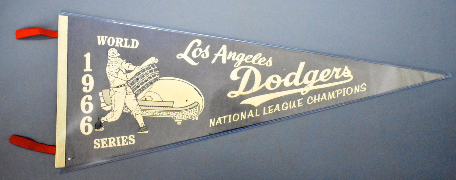 1966 Los Angeles Dodgers NL Champions felt pennant: 1966 Los Angeles Dodgers NL Champions felt pennant, very faded but no holes. It does have a small white spot on the bottom left that may have been a factory error. Measures 30" long with 3 3/4" tassle