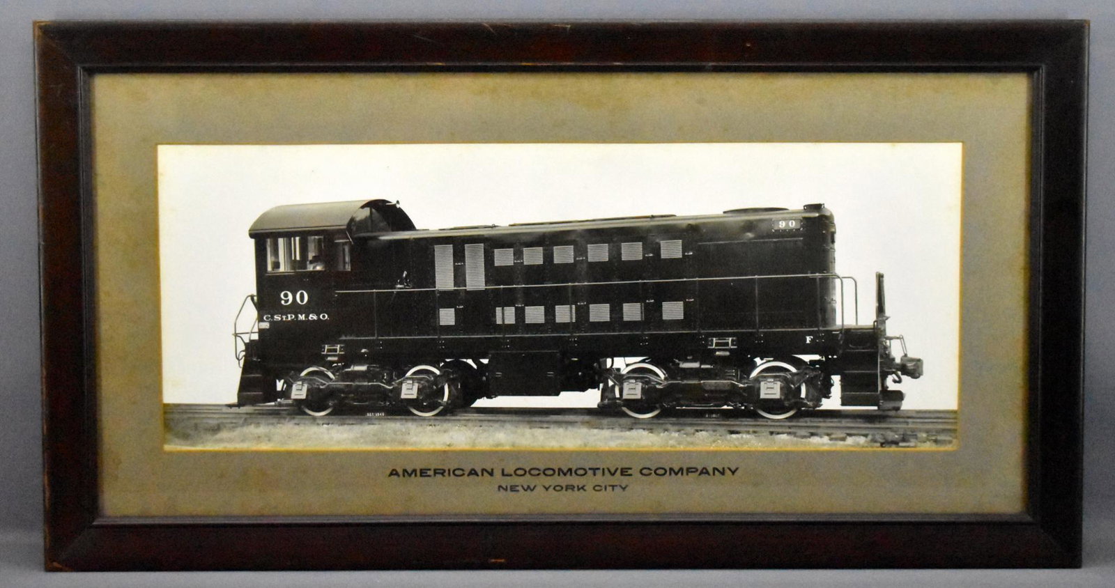 Vintage ALCO Builder Photo of a C. St. P. M. & O.: Vintage ALCO Builder Photo of a C. St. P. M. & O. diesel switcher #90 October 1940. Great photo of a brand new locomotive s she was being put into service. The frame measures 29 5/8 x 15 5/8, is made 