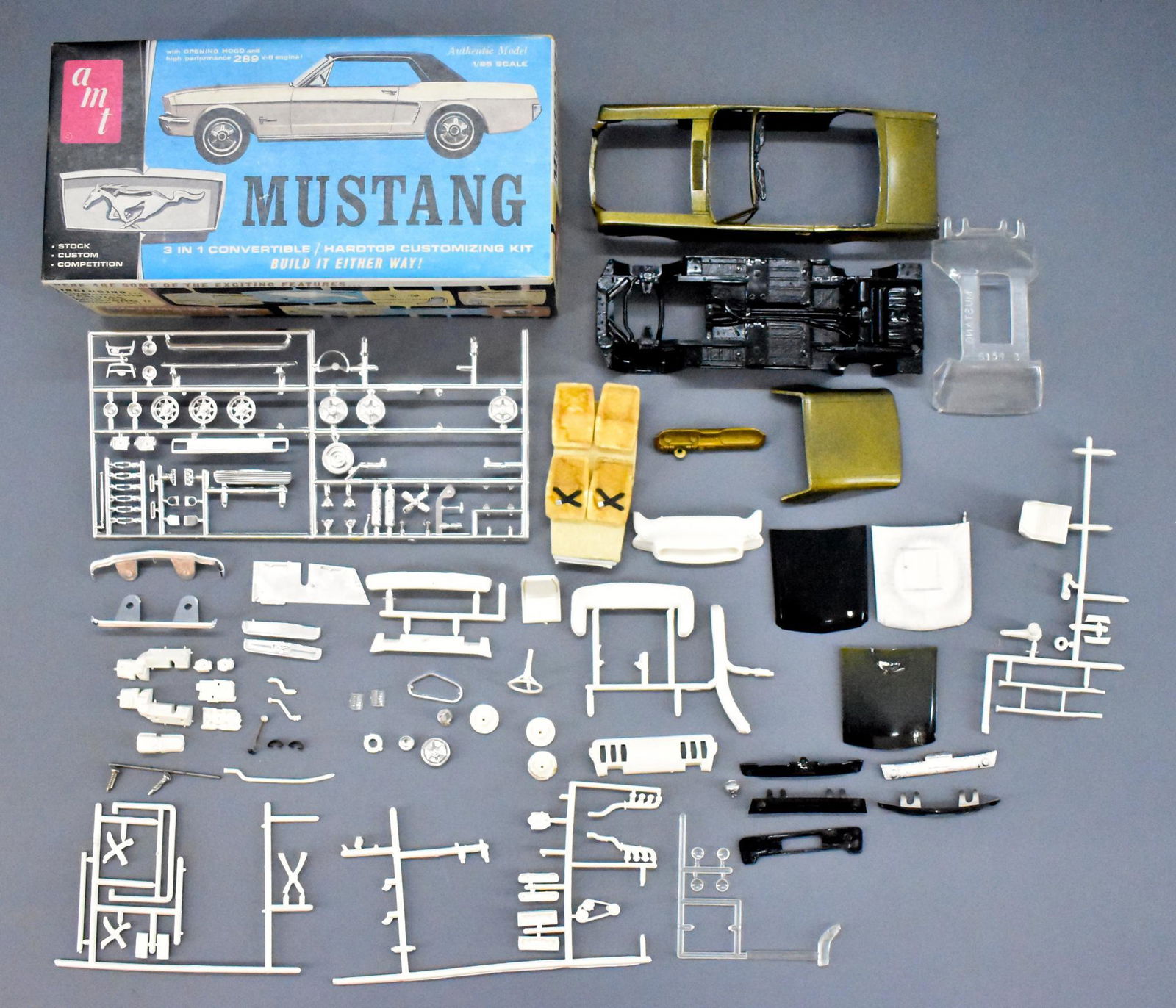AMT 1964/65 Ford Mustang coupe / convertible junkyard: AMT 1964/65 Ford Mustang coupe / convertible junkyard model kit in original box. Has had work done on it as seen in the photos, uncertain as to completeness. Sold as-is as seen in the photos with no r