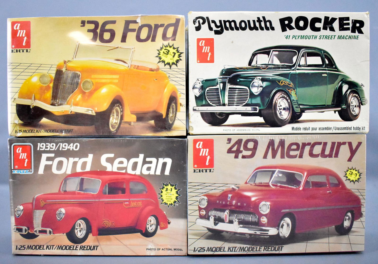 Four AMT Ertl 1/25 scale model kits 1930's and 40's: Four AMT Ertl 1/25 scale model kits 1930's and 40's cars, three factory sealed including 1936 Ford, 1939/40 Ford sedan and 1949 Mercury plus an opened but unbuilt 1941 Plymouth Rocker street machine.