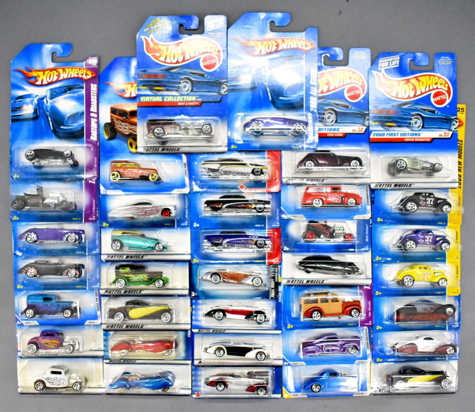 37 modern era Hot Wheels Classic and Old Time die cast: 37 modern era Hot Wheels Classic and Old Time die cast cars, mint on sealed blister cards as seen in the photos.