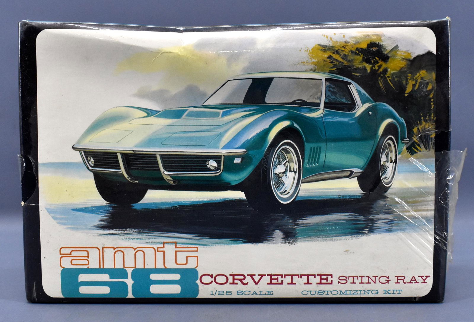 Factory sealed AMT 1968 Corvette Stingray 1/25 scale: Factory sealed AMT 1968 Corvette Stingray convertible / coupe 1/25 scale model kit, 6928-200. kit is nice sealed but the shrink wrap is torn on the right side seam that goes up to the top of the lid.
