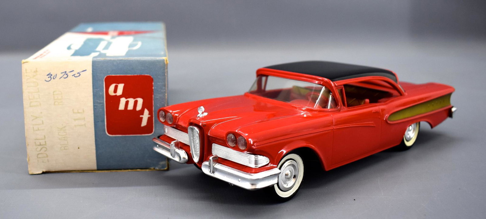 AMT 1958 Edsel Fly Deluxe dealer friction promo car in: AMT 1958 Edsel Fly Deluxe dealer friction promo car in original box. Car is near mint with a very good plus box that has one small tape repair to one end flap.