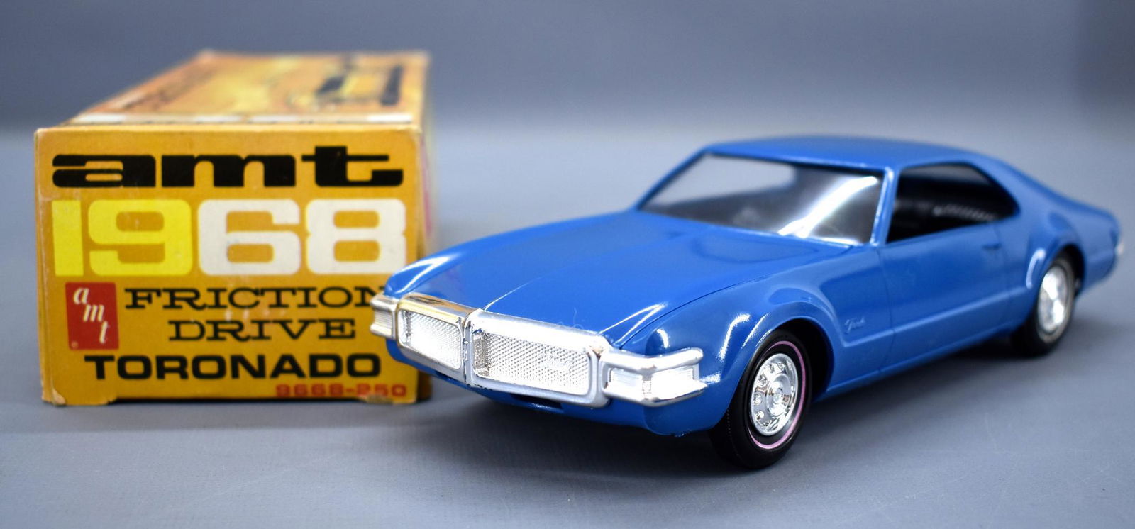 AMT 1968 Oldsmobile Toronado dealer promo coaster car: AMT 1968 Oldsmobile Toronado dealer promo coaster car in original box. Car is near mint and the box is very nice with light scuffing to panels.