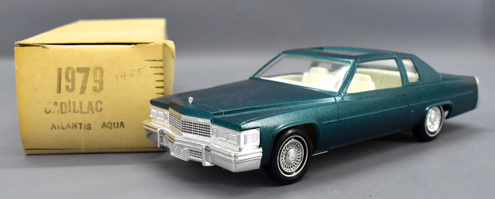 Johan 1979 Cadillac Coupe de Ville dealer promo car in: Johan 1979 Cadillac Coupe de Ville in Atlantis Aqua dealer promo car in original box. Car is near mint with a good box with age appropriate browning.