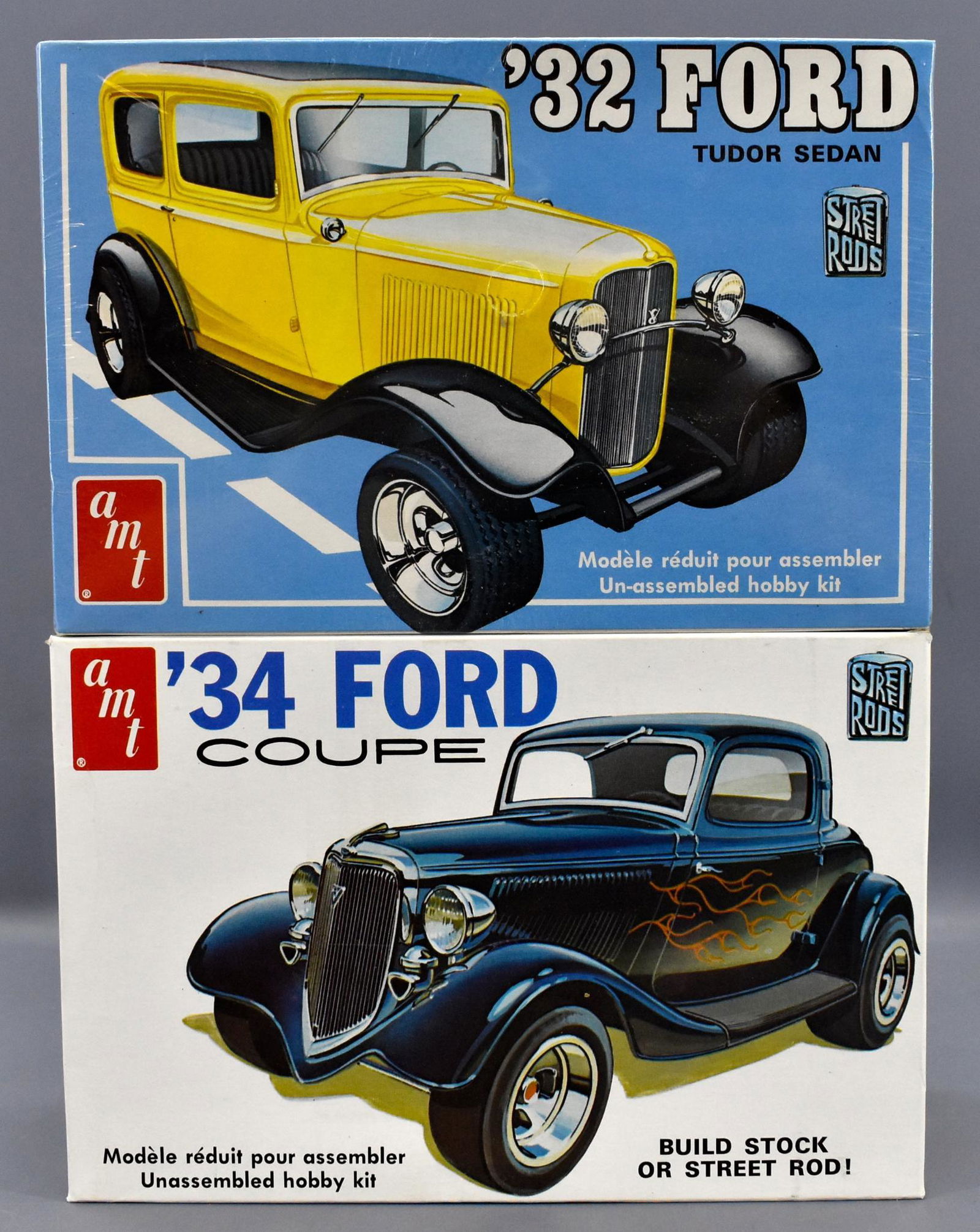 Two Mint unbuilt AMT Street Rods 1/25 scale model kits: Two Mint unbuilt AMT Street Rods 1/25 scale model kits to include a factory sealed '32 Ford tudor sedan T133 and an open box, sealed bag '34 Ford coupe T134. Both are high grade original boxes.
