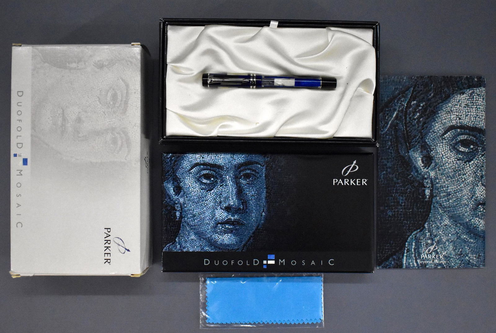 Parker Duofold Mosaic fountain pen in original box: Parker Duofold Mosaic fountain pen in original box, pen has been used but is in excellent condition with a very good original box that has a repaired split corner. The pen has an 18 karat gold nib.