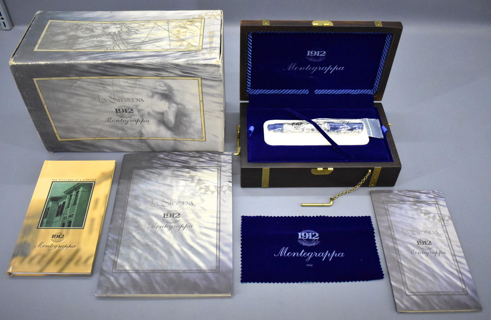 Montegrappa La Sirena luxury fountain pen in original: Montegrappa La Sirena luxury fountain pen in original box 0501/1919 Sterling Silver. The pen has been used but is in excellent to near mint condition and comes with a fantastic wooden treasure chest b