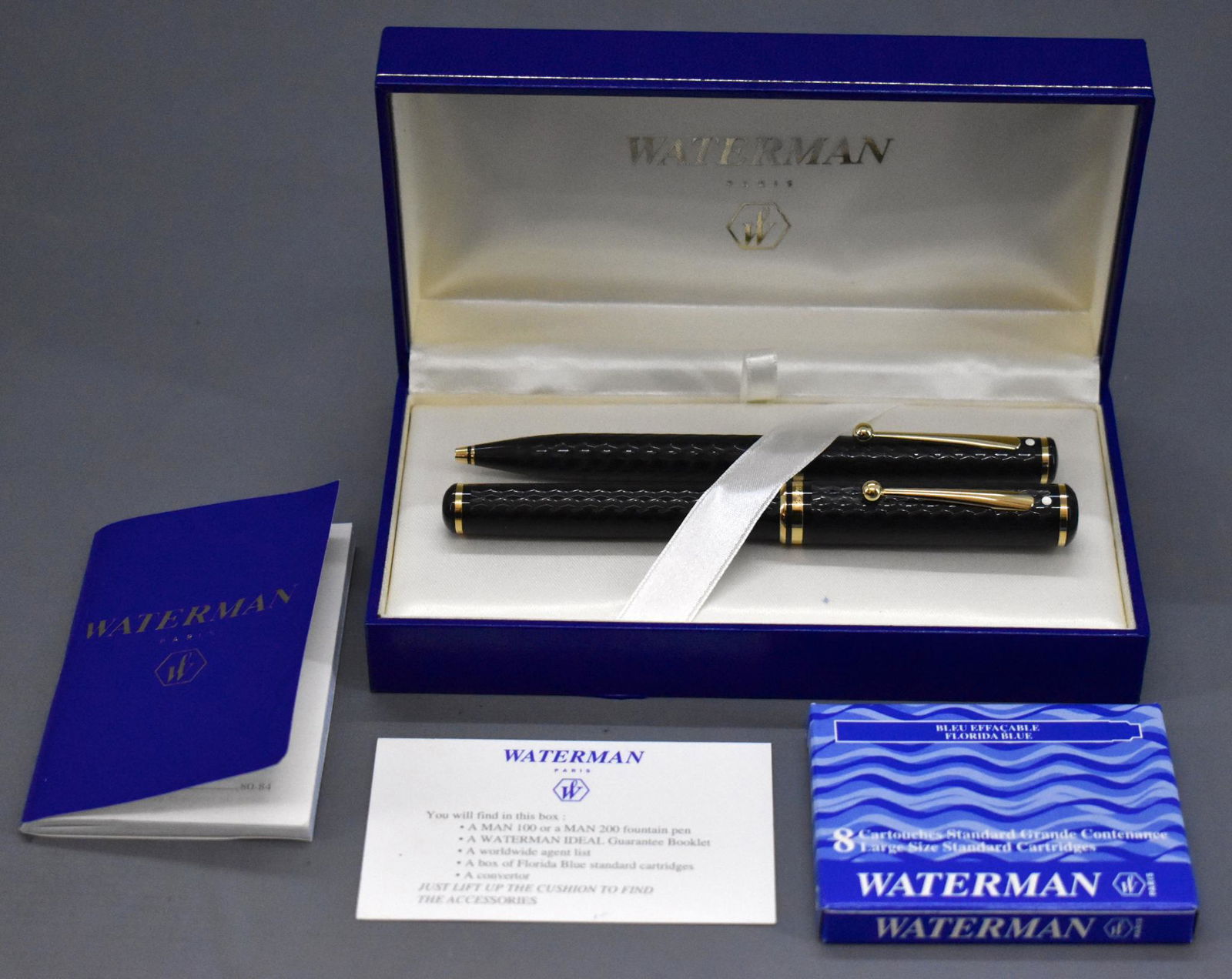 Sheaffer Connaisseur Herringbone 815 set with a: Sheaffer Connaisseur Herringbone 815 set with a Waterman hard case. Includes a fountain pen with a broad 18 karat gold nib and a ballpoint pen with a medium ball as noted on the tags that are still on