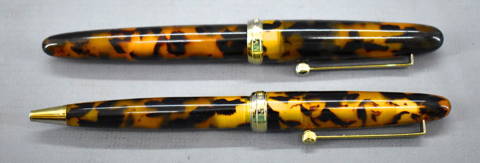 Sailor fountain pen ballpoint set Brown: Sailor fountain pen ballpoint set, Brown. Both have been used, the threads on the fountain pen will not attach the barrel to the cap. The fountain pen has a 14 karat gold nib. Sold as-is as seen in th