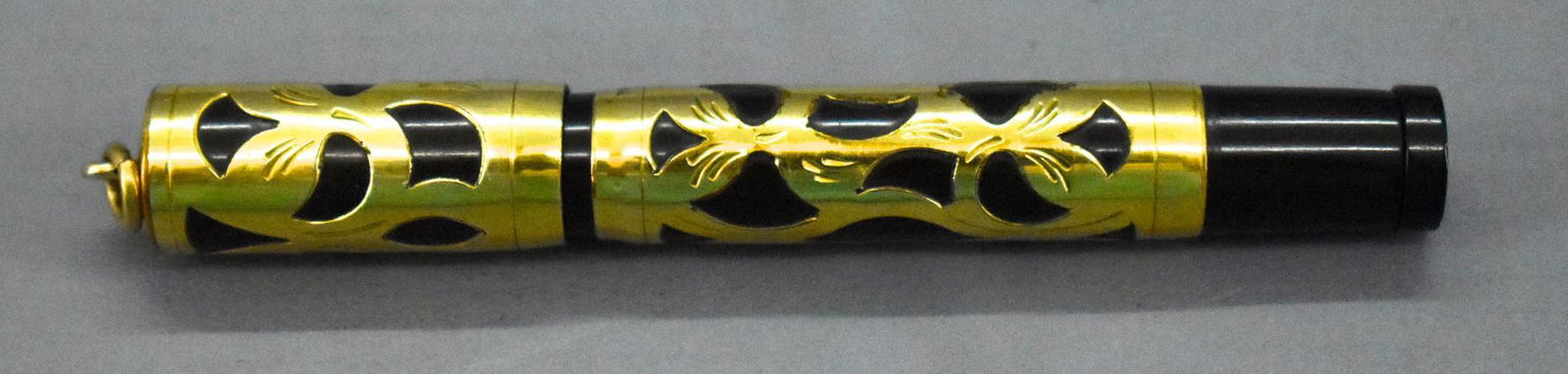 Vintage Waterman's Ideal 0542 1/2V 14K ring top: Vintage Waterman's Ideal 0542 1/2V 14K ring top fountain safety pen with gold overlay filigree, used but in nice shape cosmetically, has a 14 karat gold nib marked Waterman's Ideal Account 14-KT.