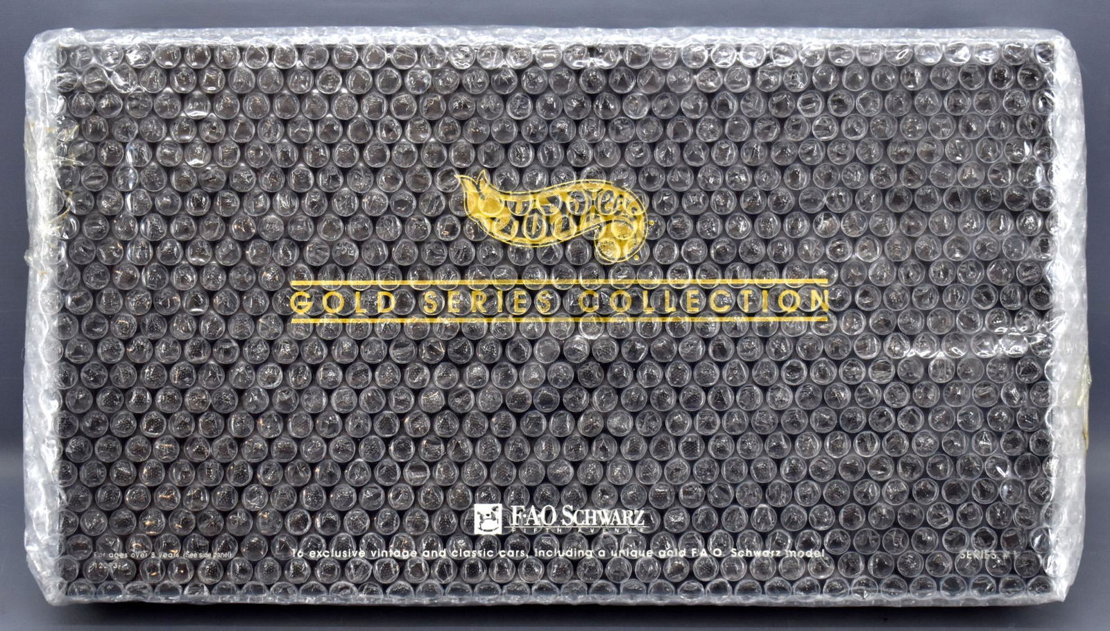 Mint factory sealed 1994 Hot Wheels FAO Schwarz Gold: Mint factory sealed 1994 Hot Wheels FAO Schwarz Gold Series Collection I, stock number 12293, still wrapped in bubble wrap from the factory. Our consignor had several of these and they were all wrappe