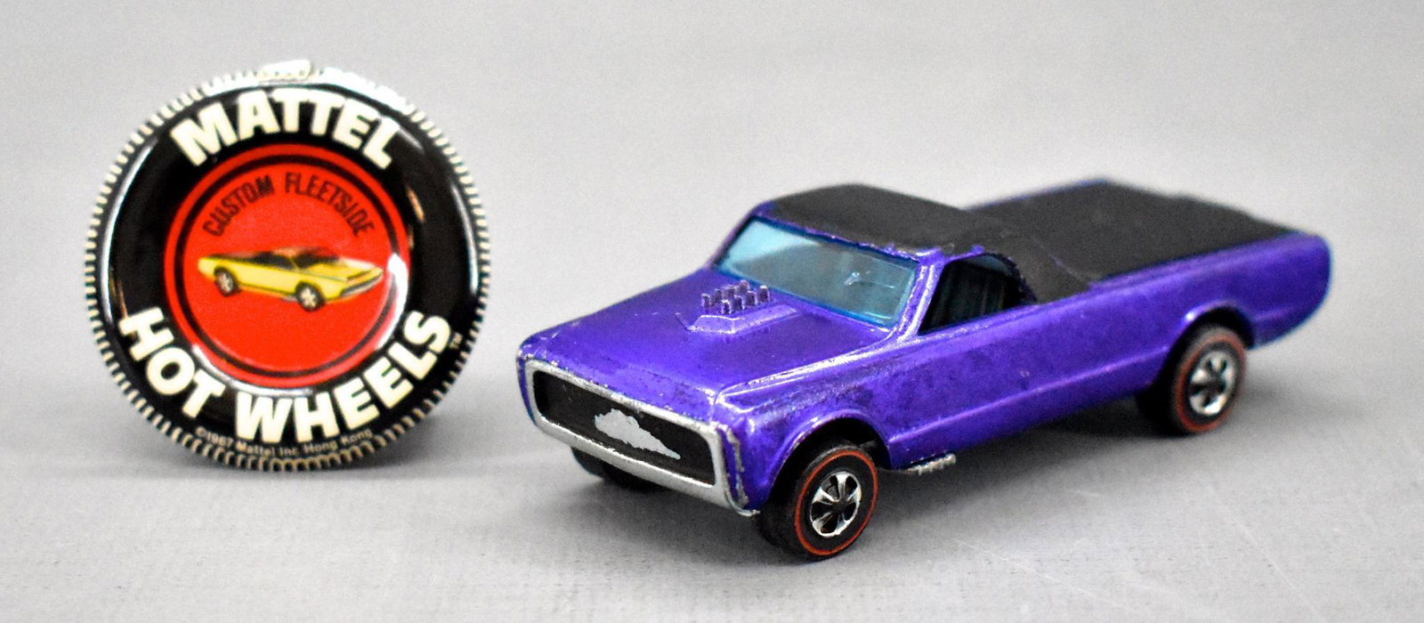 Redline Hot Wheels HK purple Custom Fleetside with: Redline Hot Wheels HK purple Custom Fleetside with original button. Very clean and shiny with a mirror base but has some paint wear as seen in the photos.