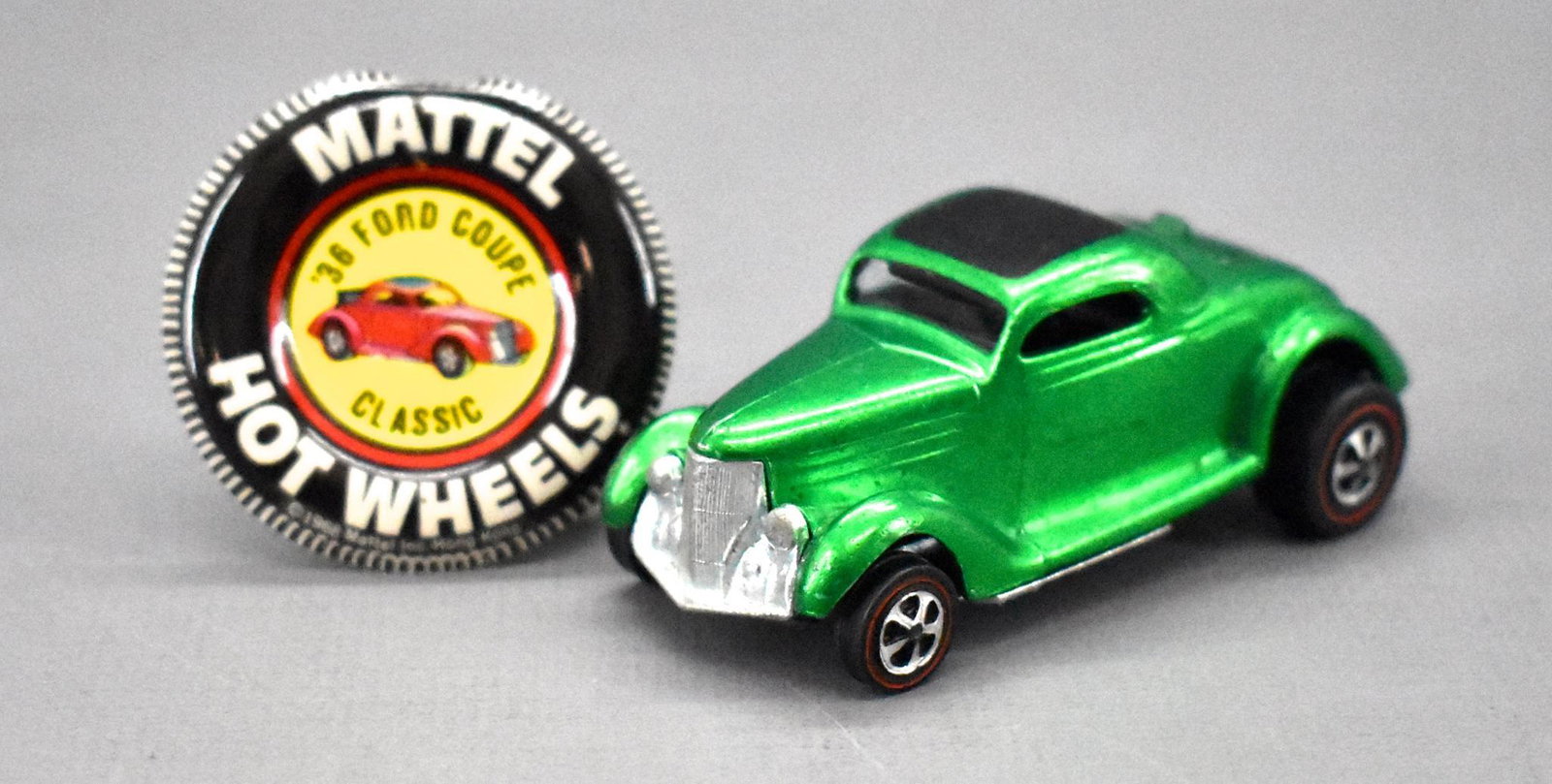 Redline Hot Wheels green Classic '36 Ford coupe with: Redline Hot Wheels green Classic '36 Ford coupe with original button. Super clean but with a few small scattered paint chips and a shiny base. Black interior.