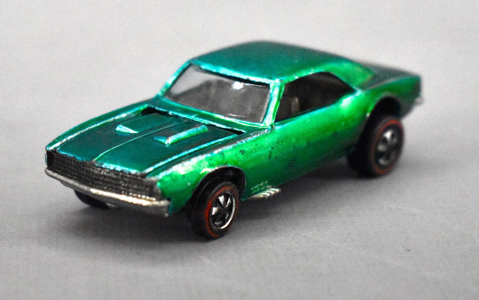 Redline Hot Wheels graqua US Custom Camaro: Redline Hot Wheels graqua US Custom Camaro, great color and clean but has paint loss from edges as well as a dinged hood corner as seen in the photos.