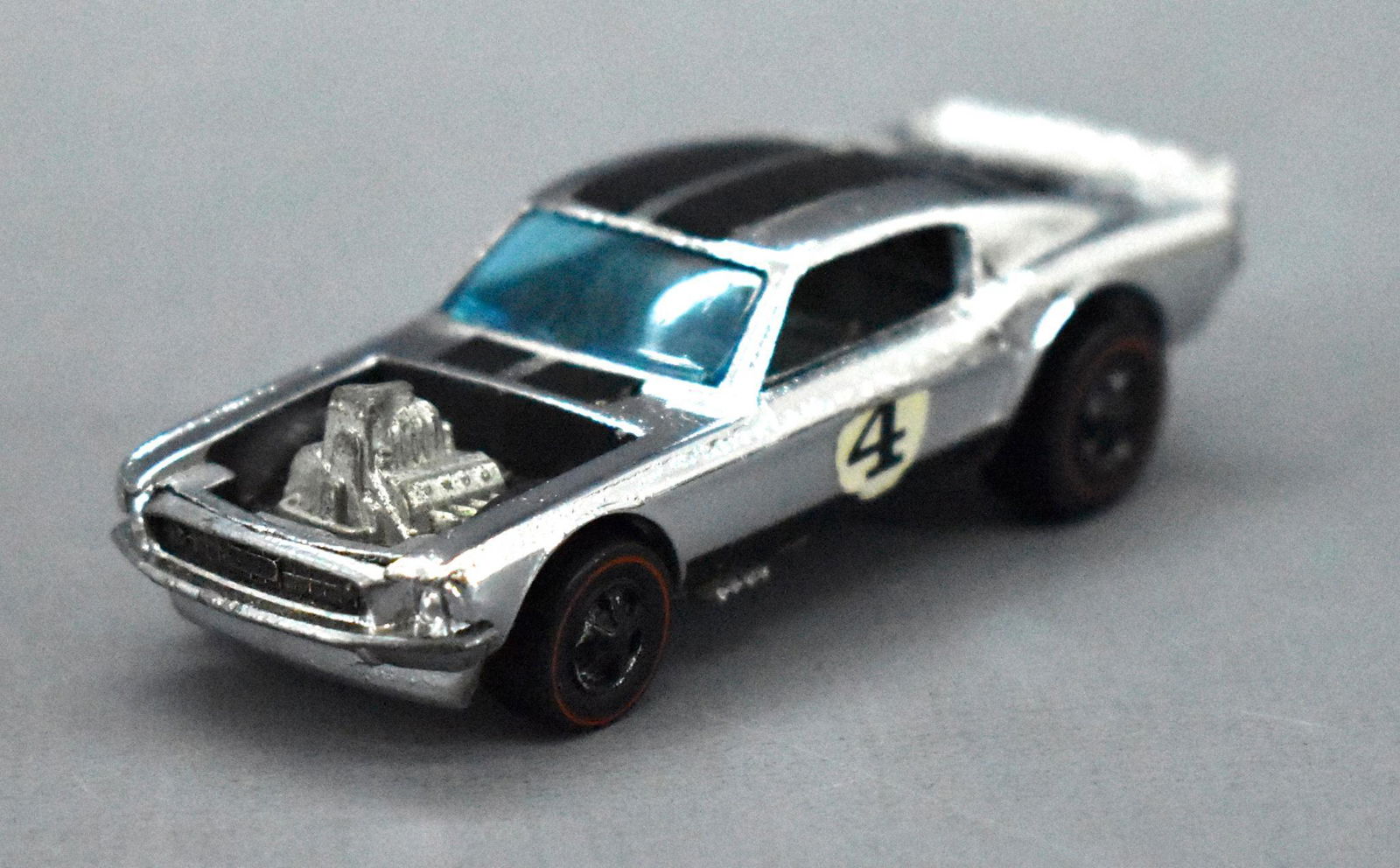 Redline Hot Wheels chrome HK Mustang Boss Hoss: Redline Hot Wheels chrome HK Mustang Boss Hoss, very clean with minor wear to the roof stripes and a very shiny base but is missing much of the chrome from the rims.