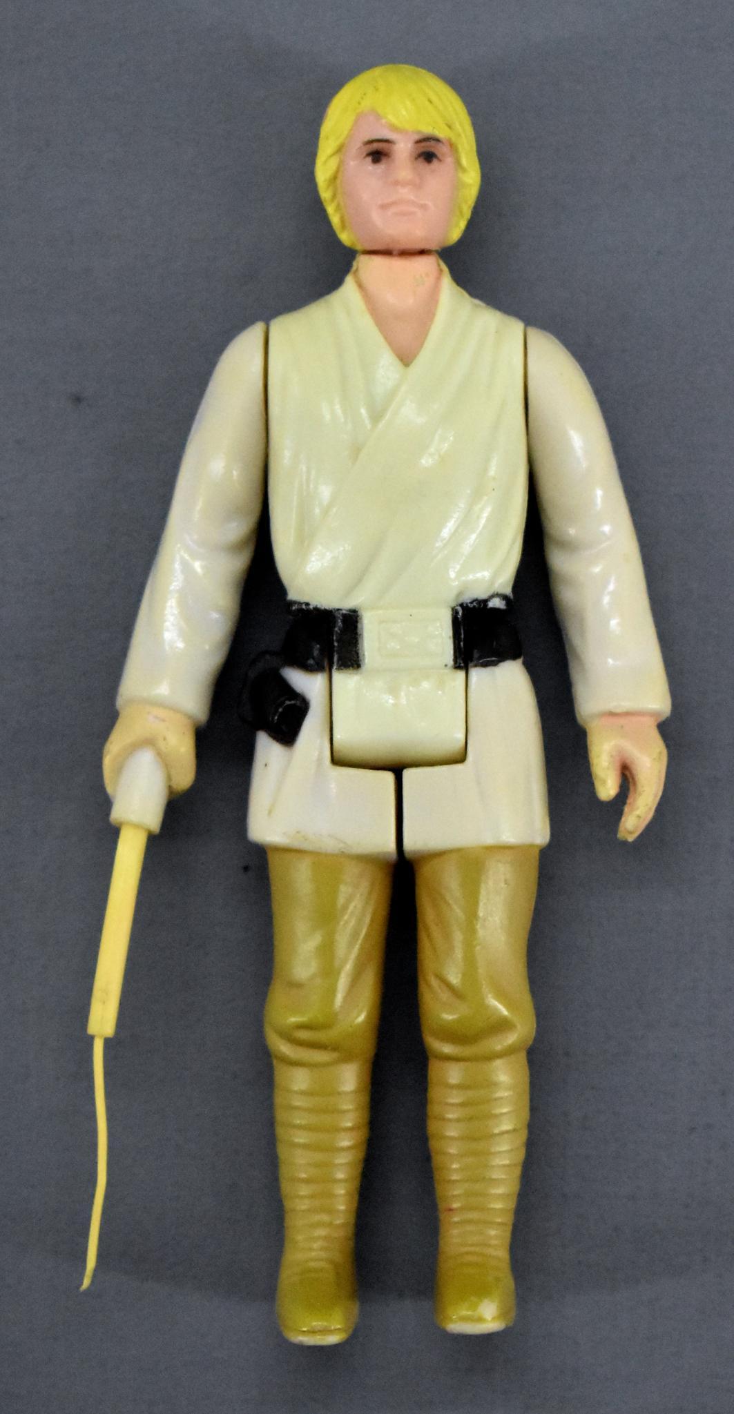 Kenner Star Wars Luke Skywalker with DT double: Kenner Star Wars Luke Skywalker with DT double telescoping light saber, 1977 Hong Kong, no markings on the bottom of the feet, G on the fat end of the saber hilt. Good condition with play wear as seen