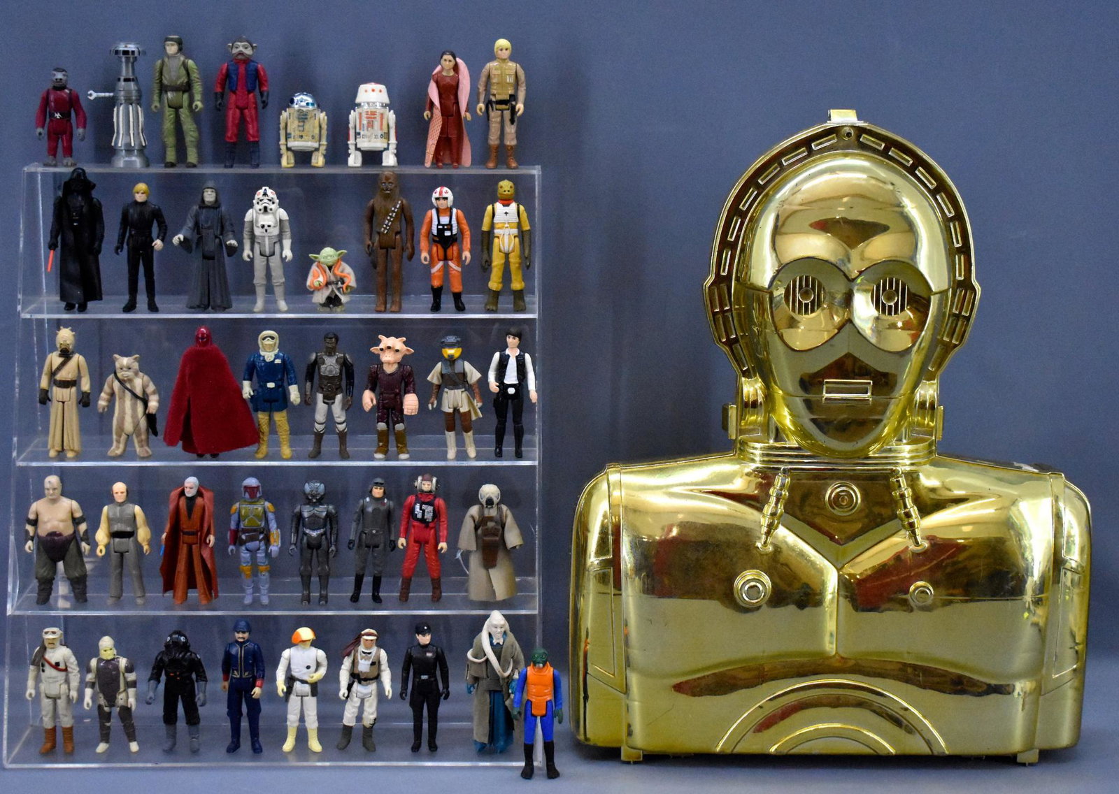 C-3PO head case full of 41 original Kenner Star Wars: C-3PO head case full of 41 original Kenner Star Wars figures. The figures are from all three movies and have various COO's. These have play wear, some more than others, no weapons and come in a case t