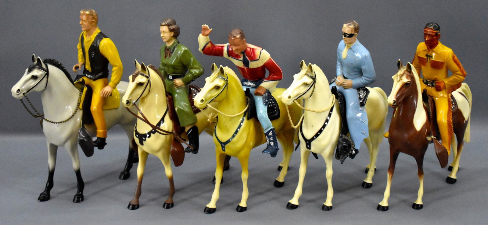 Five Hartland western cowboy figures on horses: Five Hartland western cowboy figures on horses to include Roy Rogers, Dale Evans, Lone Ranger, Tonto and matt Dillon. All figures are missing all of their accessories and Tonto's saddle is broken. Sol