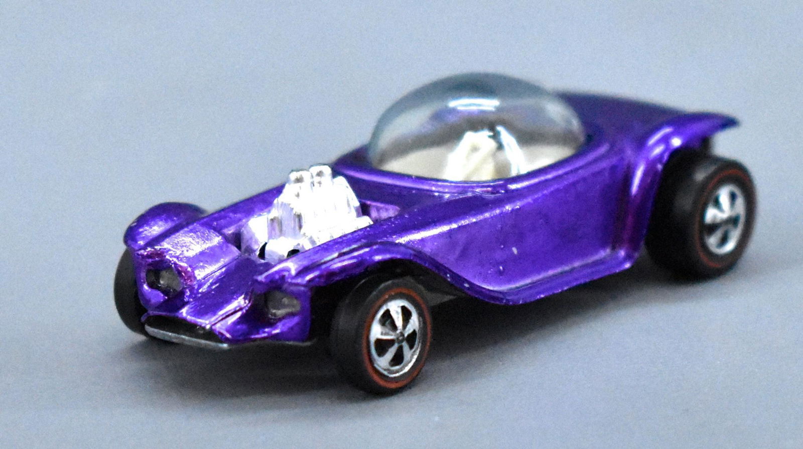 Hot Wheels Redline US Purple Beatnik Bandit: Hot Wheels Redline US Purple Beatnik Bandit with white interior. Car is blister pull quality, paint is virtually tone free, excellent glass, wheels and the base is very nice if a bit gun metaled.