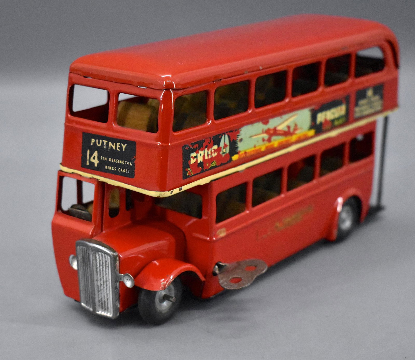 Tri-ang Minic London Transit clockwork double decker: Tri-ang Minic London Transit clockwork double decker bus . The bus is clean with some wear to the decals and minor paint loss from one side. The clockwork is in working order. The bus measures