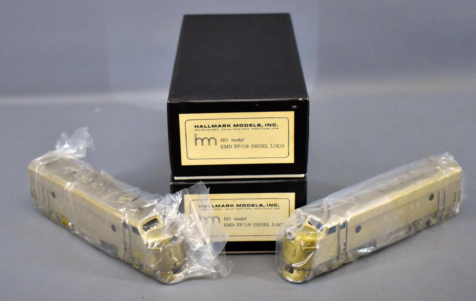 Two Hallmark HO scale brass EMD FP-7/9 diesel: Two Hallmark HO scale brass EMD FP-7/9 diesel locomotives in original boxes, neither ha been unwrapped since packed, C10 in near mint original boxes with original foam inserts and original paperwork.