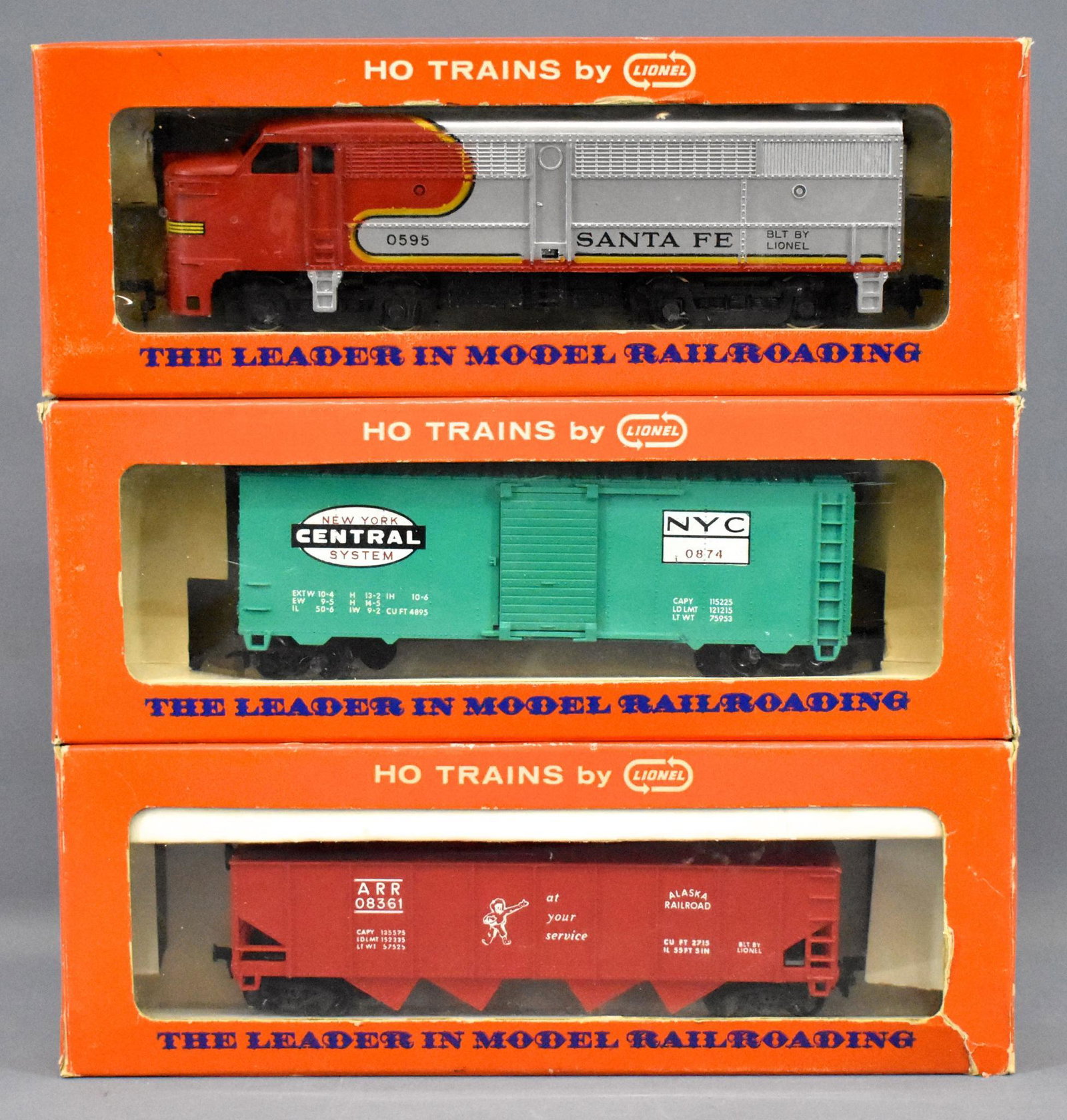 Lionel postwar HO 0595 0874 0836-110 in original boxes: Lionel postwar HO 0595 powered Santa Fe Alco FA diesel locomotive, 0874 New York Central box car and 0836-110 Alaska hopper, C7+ in fair to excellent original boxes.
