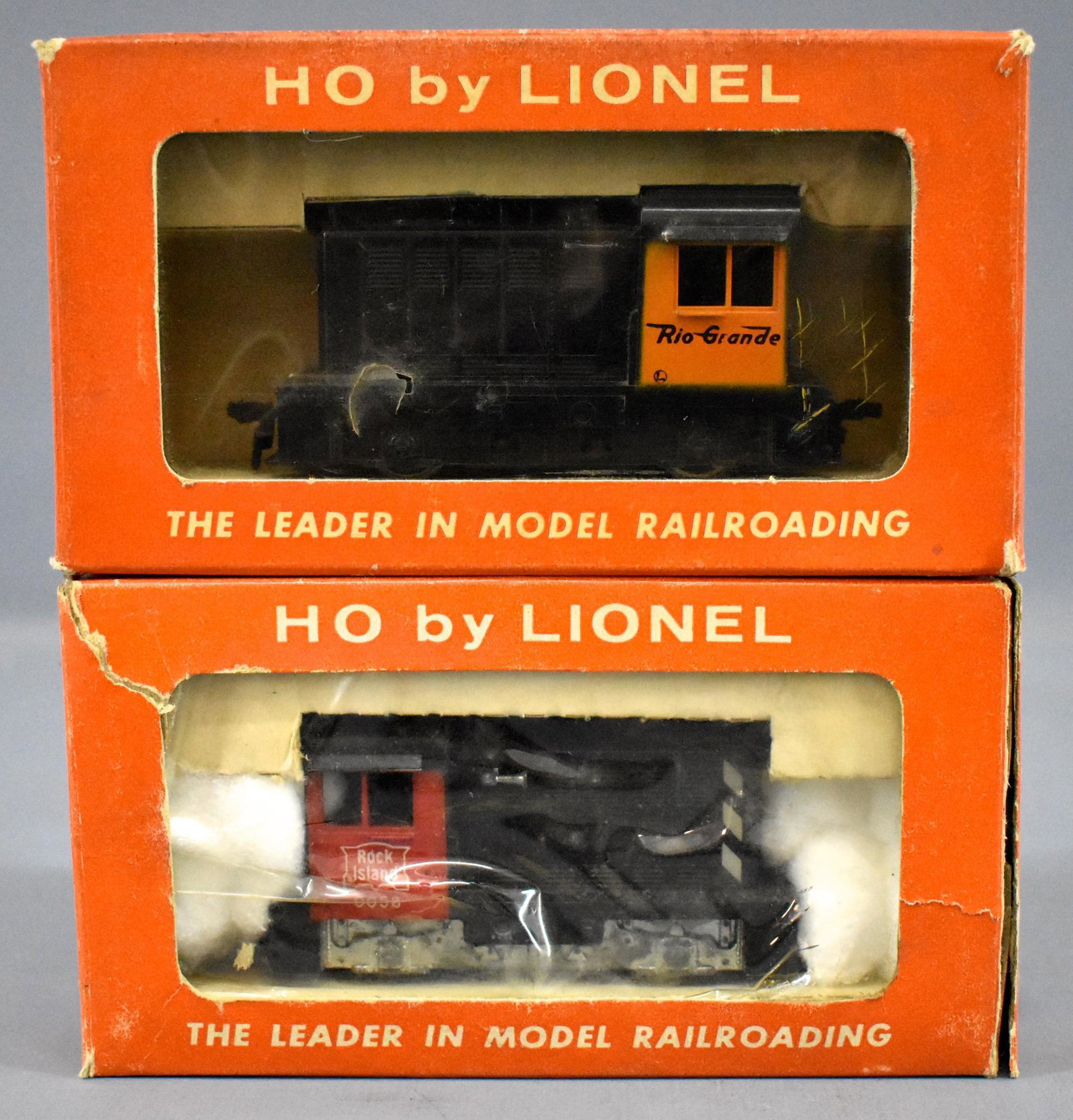 Lionel postwar HO Husky switchers in original boxes: Lionel postwar HO Husky switchers in original boxes to include 0560 Rio Grande and 0058 Rock Island with a broken step. The Rio Grande box is excellent while the Rock Island box is fair.