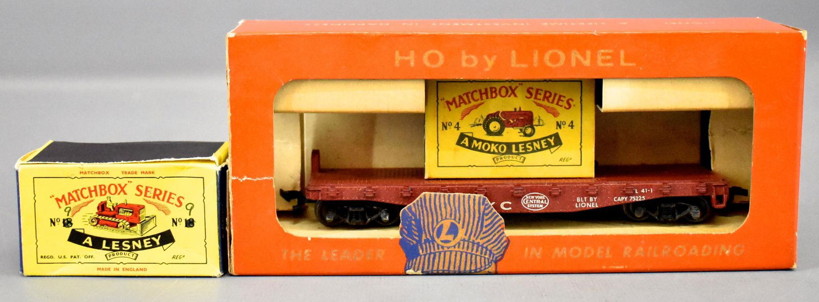 Lionel postwar HO 0808 New York Central flat car with: Lionel postwar HO 0808 New York Central flat car with Matchbox No. 4 tractor load plus a No. 18 dozer, both in original boxes. The flat car I missing at least one step and the original box is missing