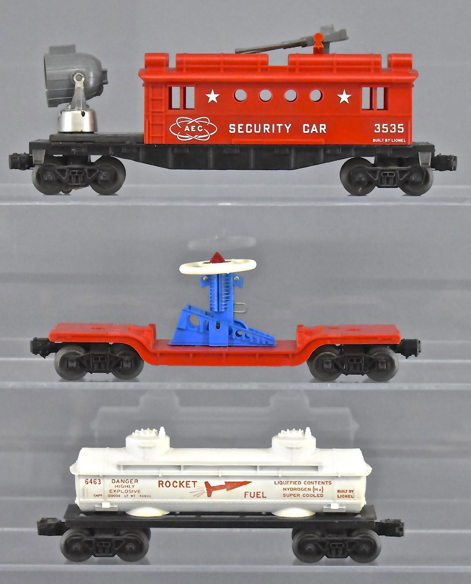Group of three Lionel postwar O gauge military space: Group of three Lionel postwar O gauge military space cars. Group includes 3309 turbo missile launching flat car, 6463 Rocket fuel tanker and 3535 Security car, C6-7.