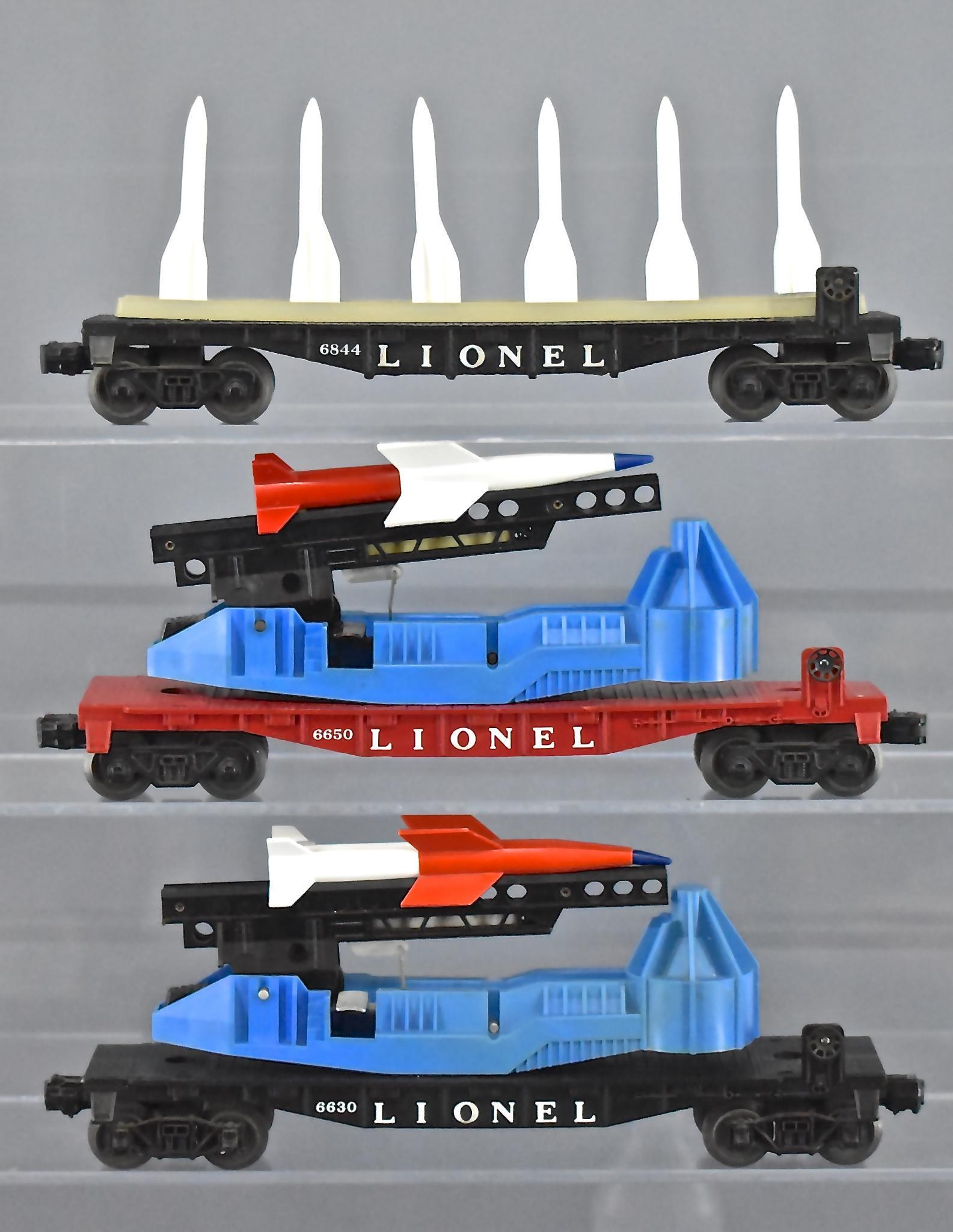 Group of three Lionel postwar O gauge military space: Group of three Lionel postwar O gauge military space cars. Group includes 6630 missile launching flat car, 6650 missile launching flat car and 6844 missile carrier flat car, C6-7.