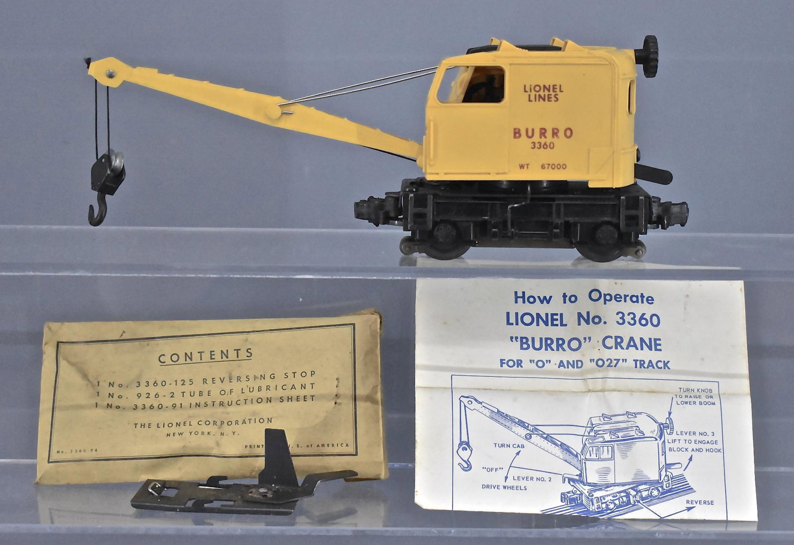 Lionel postwar O gauge 3360 Burro Crane car with packet: Lionel postwar O gauge 3360 Burro Crane car. This car is clean complete and no missing or broken parts, it includes a reversing stop as seen.