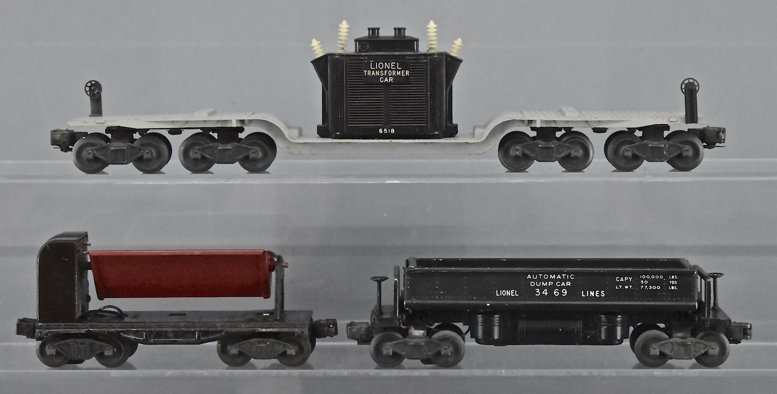 Group of three Lionel postwar O gauge train cars: Lionel postwar O gauge freight cars to include 6518 Transformer car, 3559 automatic dump car and 3469 automatic dump car, C5-6.