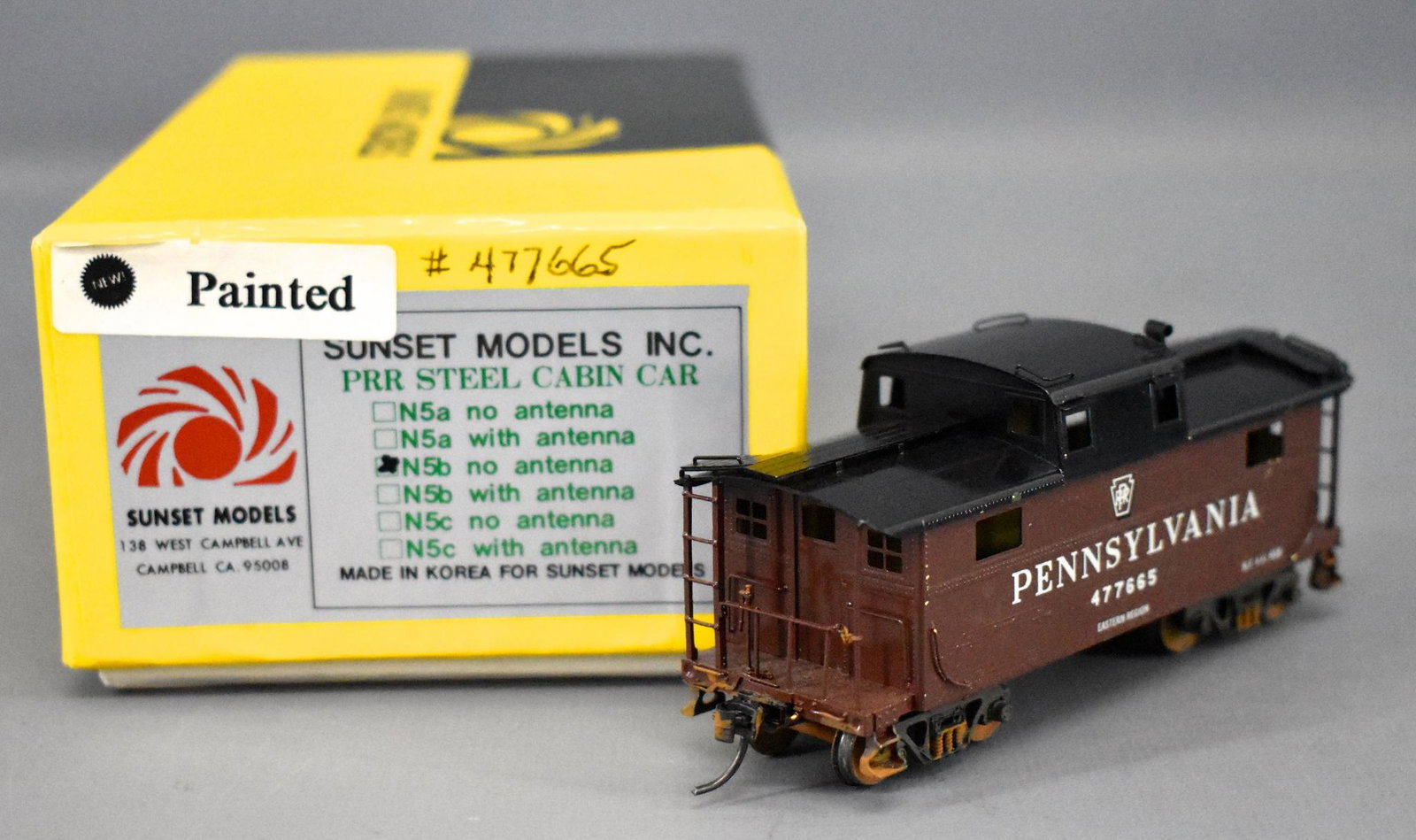 Sunset HO scale brass factory painted N5b no antenna: Sunset HO scale brass factory painted N5b no antenna caboose in original box, caboose is C7-8 with a few scattered tiny paint chips, comes in a very good original box with some writing in spots.