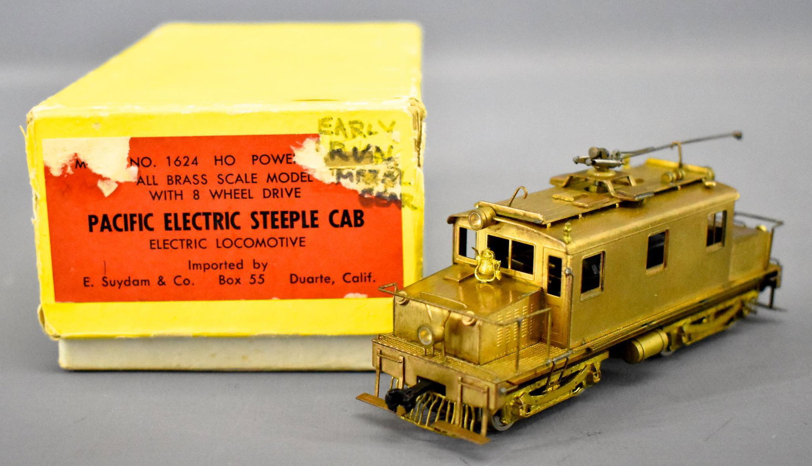 E. Suydam HO scale brass Pacific Electric Steeple Cab: E. Suydam HO scale brass Pacific Electric Steeple Cab Locomotive in original box, locomotive is C7 with light tarnish in spots and the center truck connector is broken and in need of replacement, easy