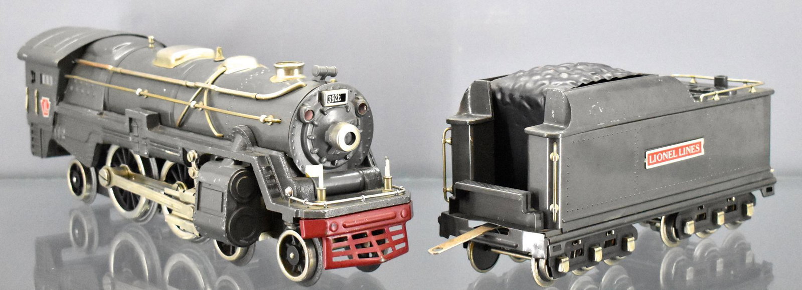 Lionel prewar standard gauge 392E steam locomotive and: Lionel prewar standard gauge 392E steam locomotive and tender. Locomotive has a reproduction frame and has MEW replacement wheels. The 392W tender is original with warping casting at the top around th