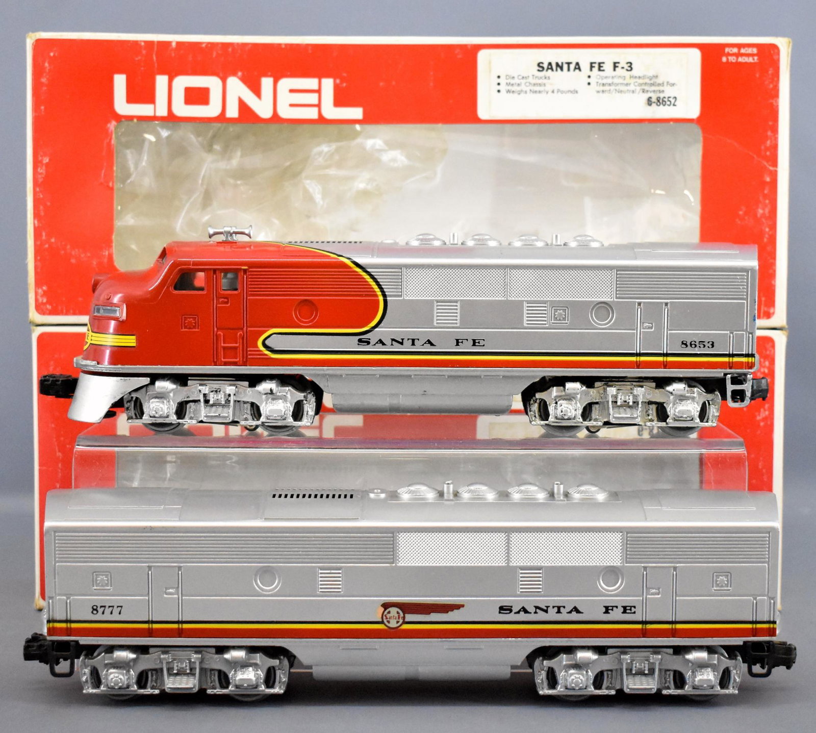 Lionel modern era O Santa Fe F3 AB set in original: Lionel modern era O Santa Fe F3 AB set in original boxes to include 8652 powered A and 8777 non-powered B units, C7 with light run time in good original boxes.