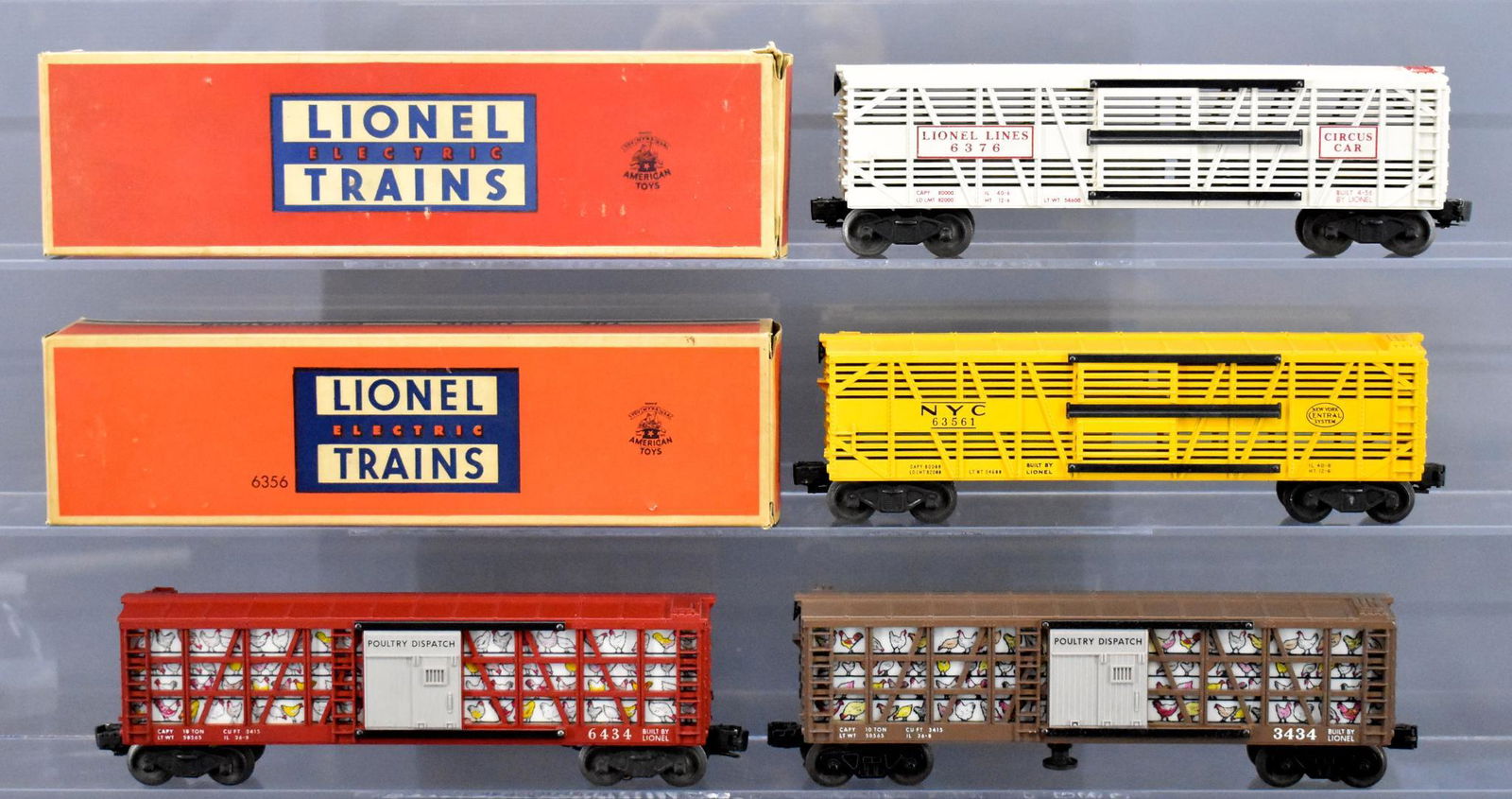Four Lionel postwar O gauge freight cars with two: Four Lionel postwar O gauge freight cars with two original boxes. Includes 3434 chicken sweeper car with pitting on the door guide just below the sweeper figure, 6434 poultry dispatch, 6356 New York C