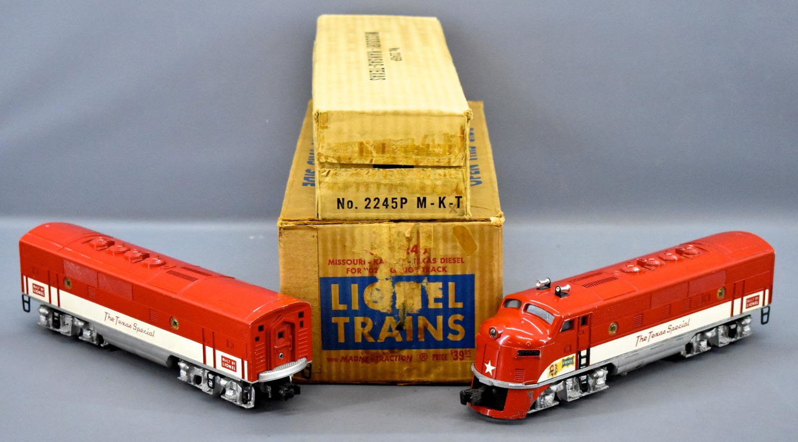 Lionel postwar O gauge 2245 MKT Texas Special F3 AB set: Lionel postwar O gauge 2245 MKT Texas Special F3 AB set in master carton. Both units are very clean with moderate run time, C7 with replacement porthole lenses. The master carton has surface skinning