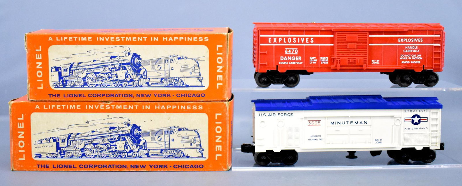 Lionel postwar O 3665 Minuteman and 6470 Exploding: Lionel postwar O 3665 Minuteman and 6470 Exploding Target range car with one original box, both are very clean, the 6470 is unrun and c8-9 with an incorrect 6448 box, the 3665 shows very light run tim