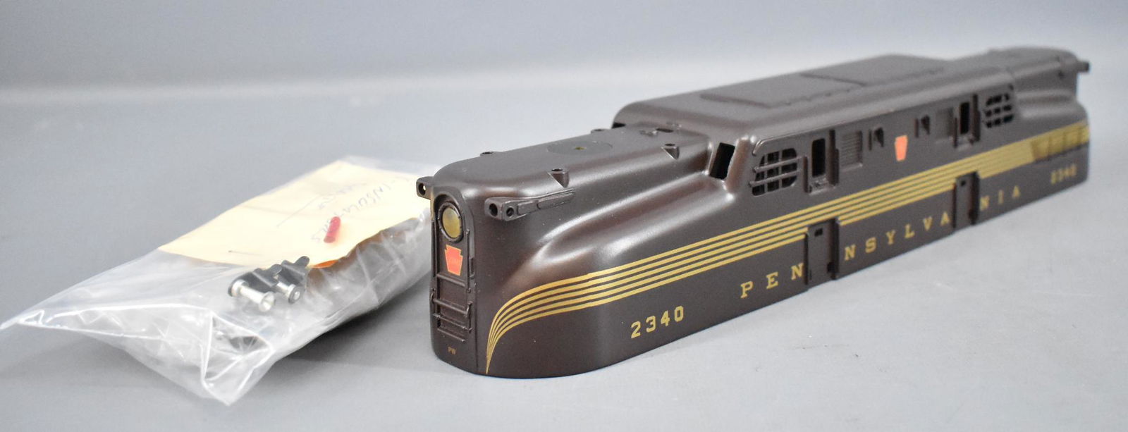 Custom painted Lionel modern era O Pennsylvania GG-1: Custom painted Lionel modern era O Pennsylvania GG-1 shell. Part no 6-10-8313-005, painted nicely to emulate a postwar Tuscan 2340 GG-1. Comes with pantographs, horns, ladders and light lenses for fin