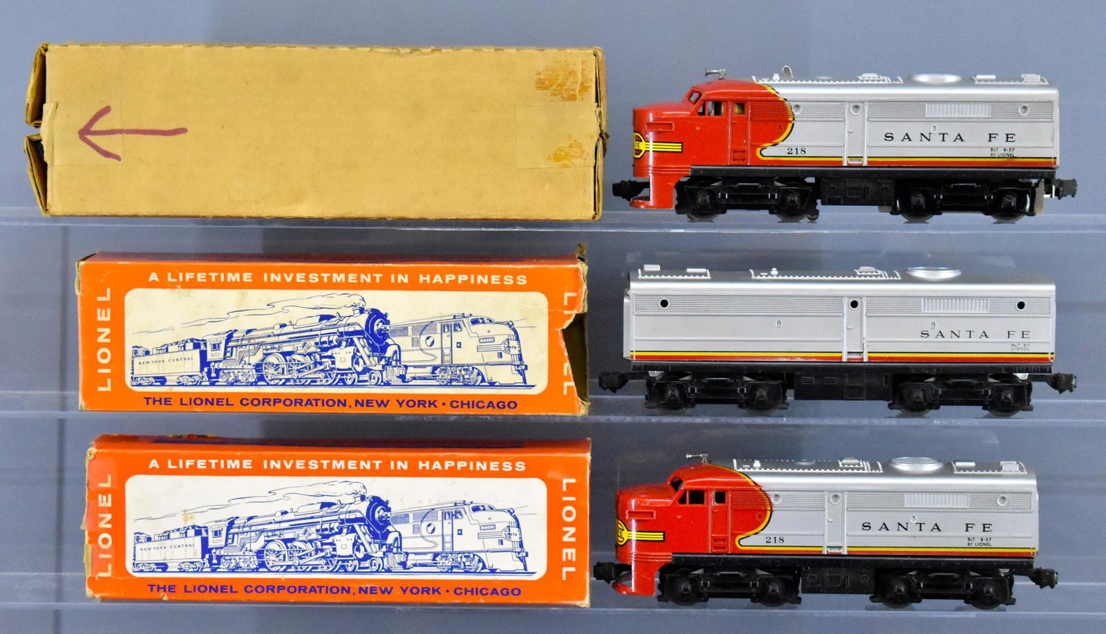 Lionel postwar O gauge 218 Santa Fe Alco ABA set in: Lionel postwar O gauge 218 Santa Fe Alco ABA set in original boxes. Both A units have cracked skirts, the non-powered A unit has a solid nose decal. The corrugated box is good while the other two are 