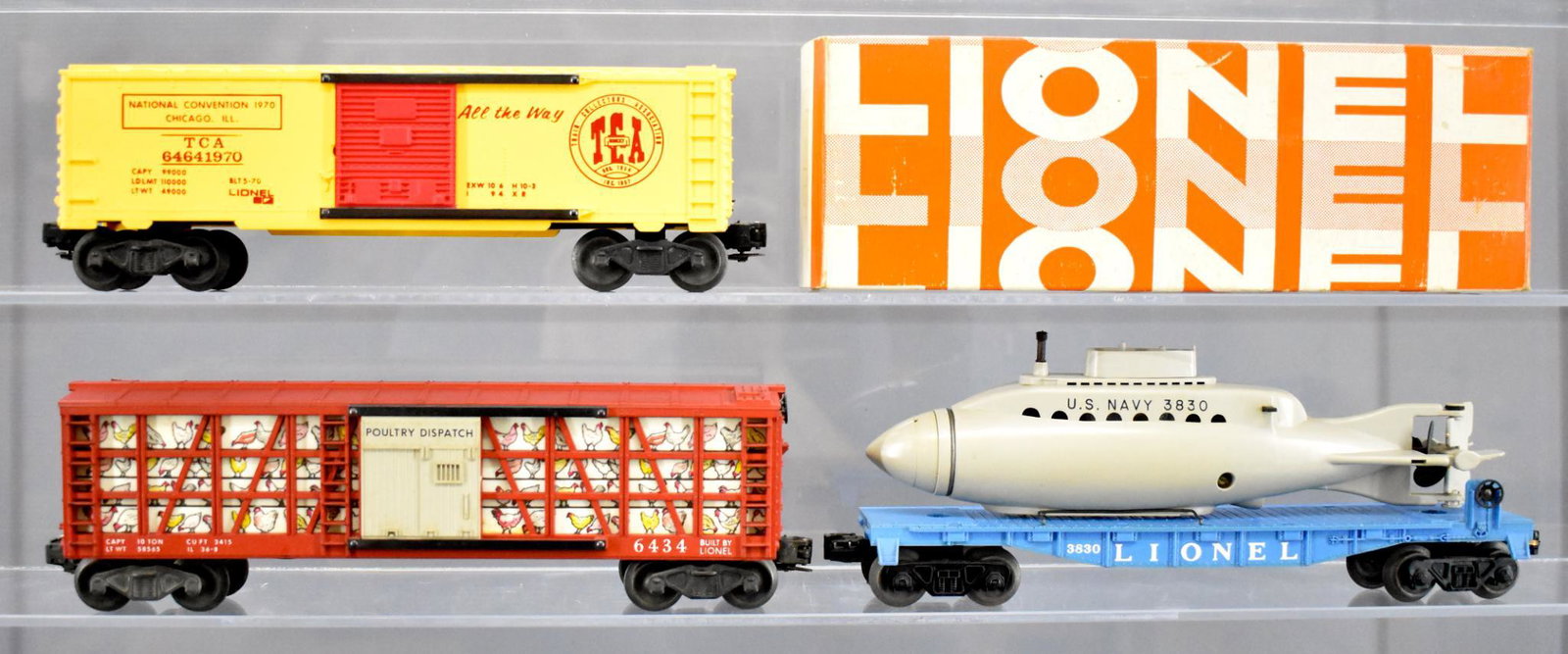 Lionel postwar O gauge 3830 6434 and 6464-1970 with one: Lionel postwar O gauge 3830 flat car with operating submarine, C6 with rubber bands missing from the inside of the sub; 6434 poultry dispatch, C6+ and 6464-1970 box car with original box, C6-7.
