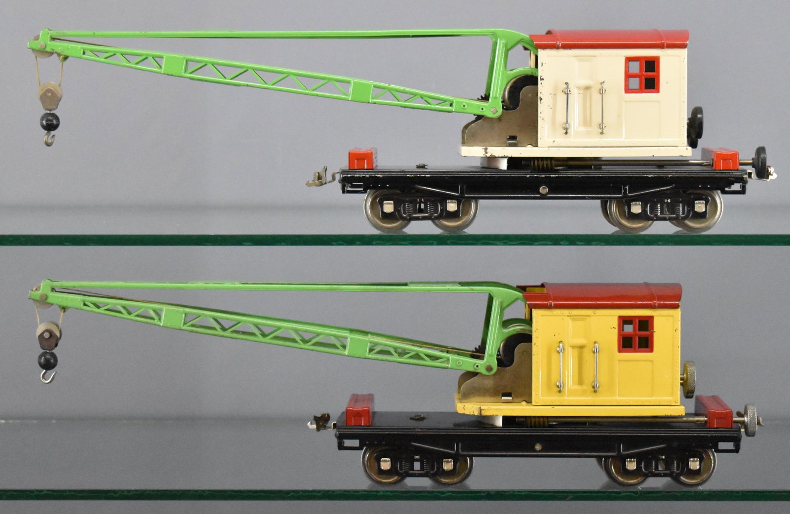 Two different Lionel prewar standard gauge 219 crane: Two different Lionel prewar standard gauge 219 crane cars to include cream cab / red roof with one reproduction coupler, C7, and yellow cab with red roof, C6.
