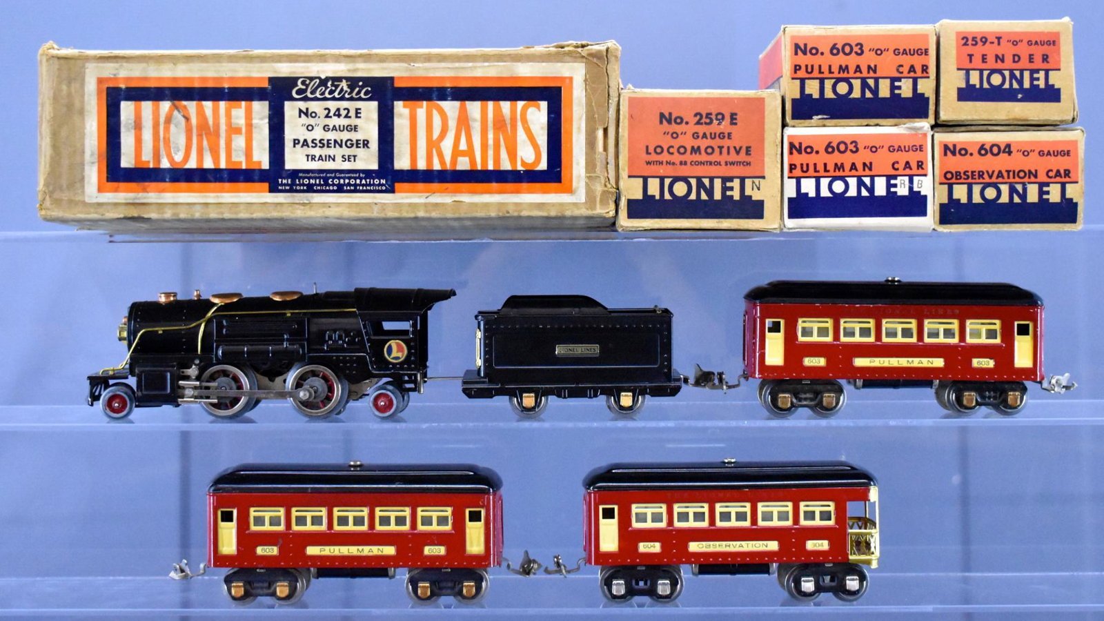 Boxed Lionel prewar O gauge 242E steam passenger set: Boxed Lionel prewar O gauge 242E steam passenger set to include 259E steam locomotive, 259T sheet metal tender, two 603 Pullman cars with black roofs and red sides (one car has a completely repainted 