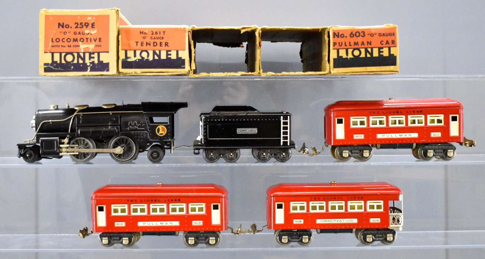 Lionel prewar O gauge steam passenger set with 259E: Lionel prewar O gauge steam passenger set with worn original boxes to include 259E steam locomotive, 261T tender, two 603 Pullman and 604 observation cars, C7 with worn boxes.