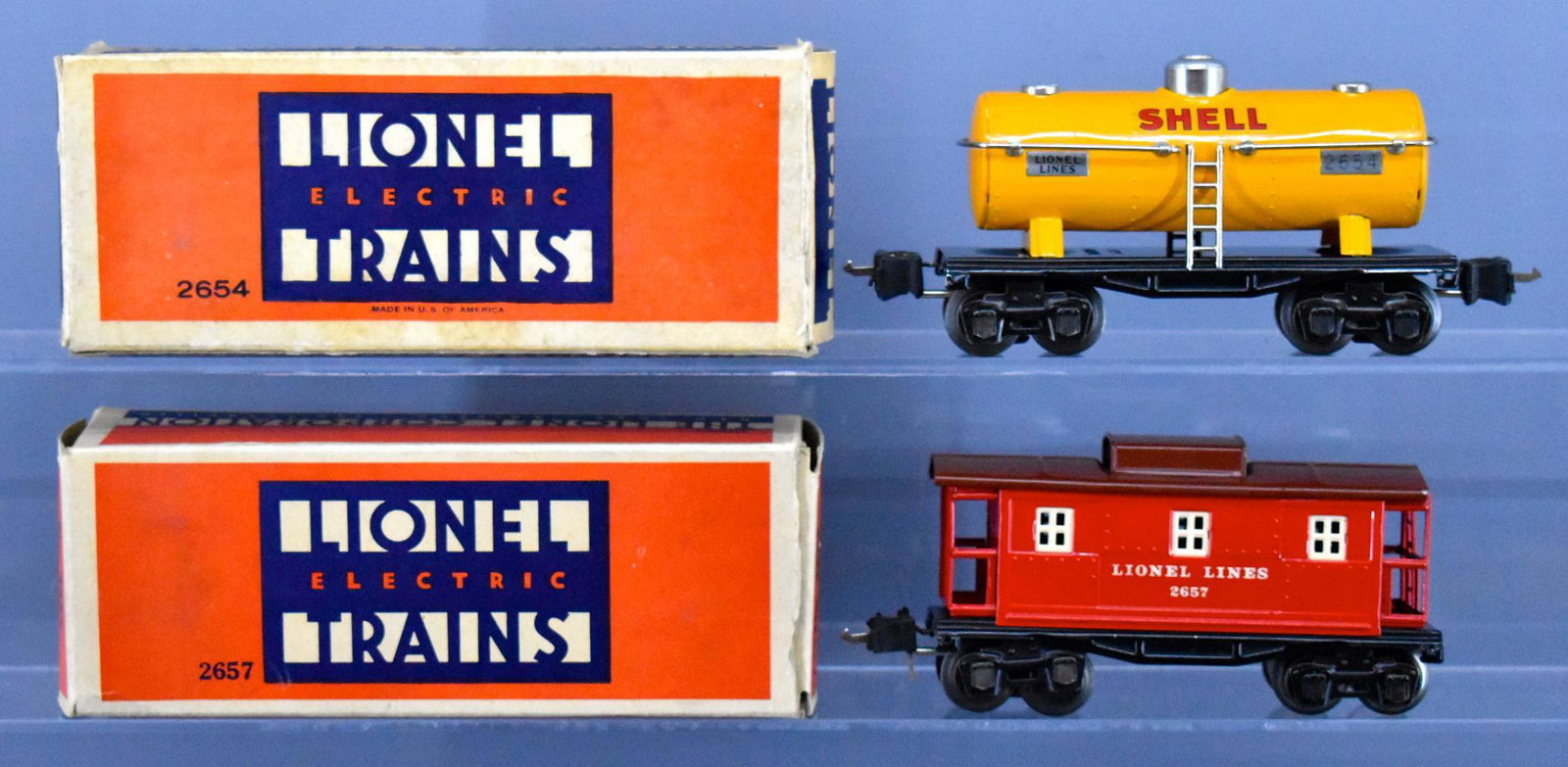 Lionel prewar O gauge 2654 and 2657 freight cars in: Lionel prewar O gauge 2654 2657 freight cars in original boxes. includes 2654 Shell tank car and 2657 caboose with red sides and maroon roof, C7-8 with very good original boxes that are missing couple