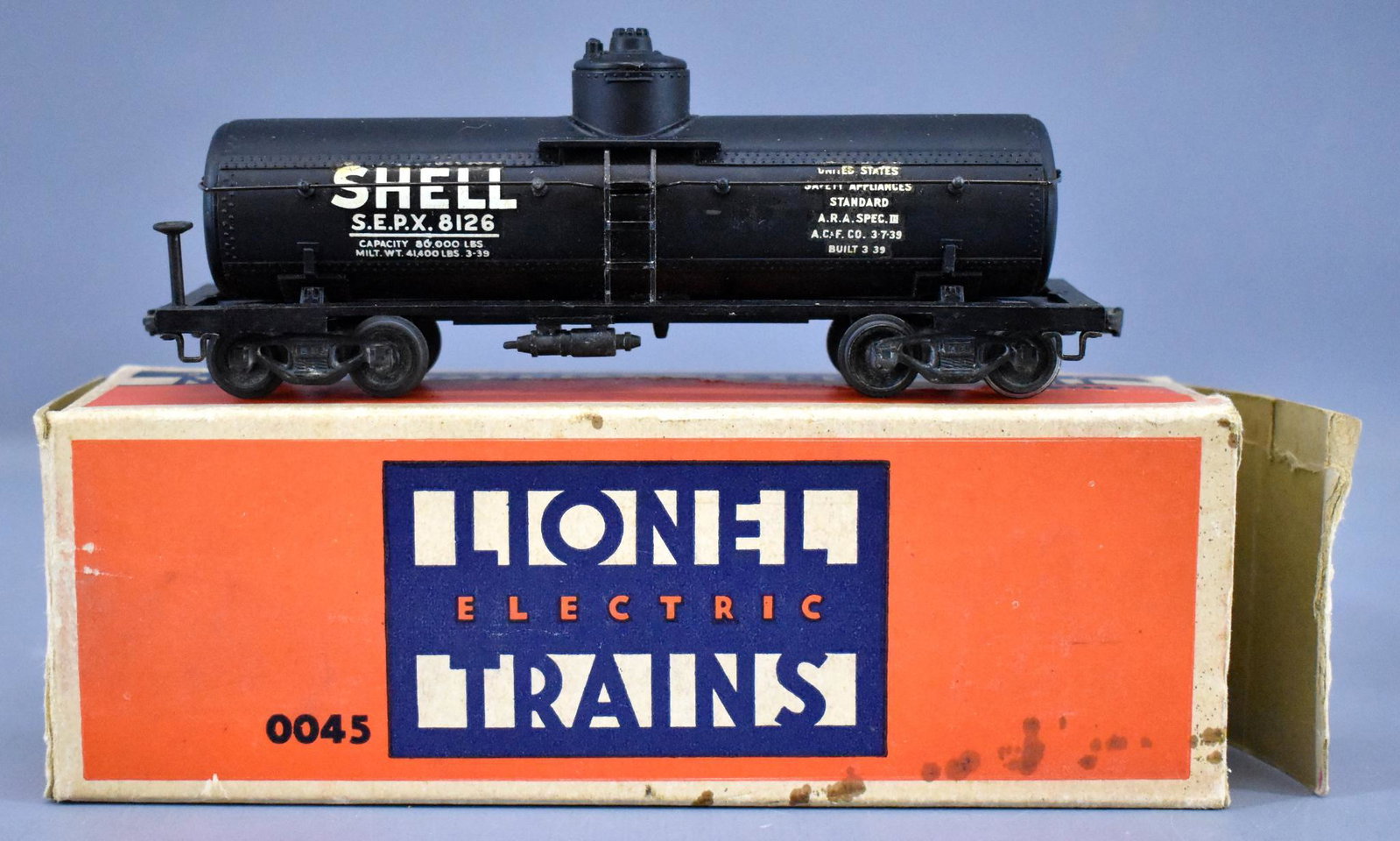Lionel prewar OO 0045 2-rail Shell tank car in original: Lionel prewar OO 0045 2-rail Shell tank car in original box, C8 in a good original box that is missing a tuck flap.